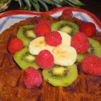vegan waffles with bananas, kiwi, and raspberries