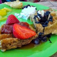 vegan waffles with strawberries & chocolate syrup