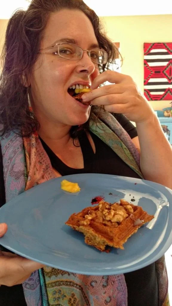 Megan eating a vegan waffle