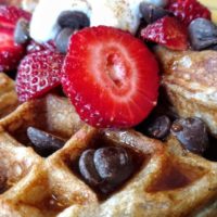 vegan waffle with strawberries and chocolate chips